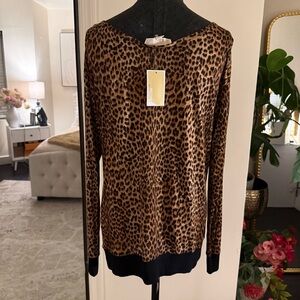 Michael Kors leopard print sheer blouse featuring a distinct black bottom Hem